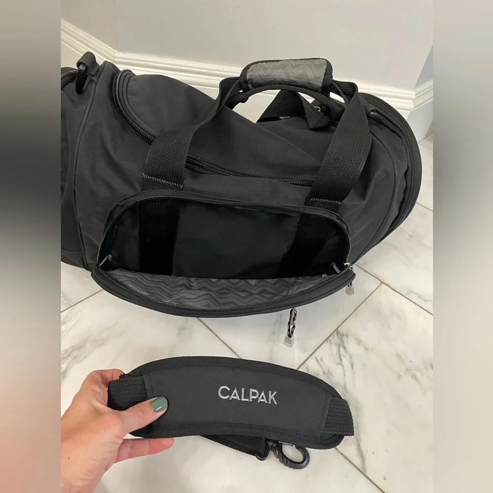 Calpak black canvas multi-pocket dual strap duffel bag travel luggage gym